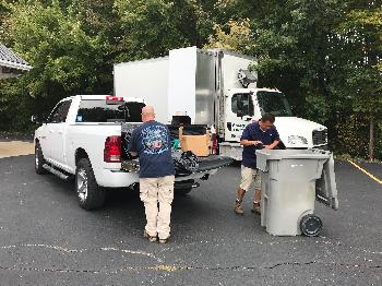 member gets assistance with shredding